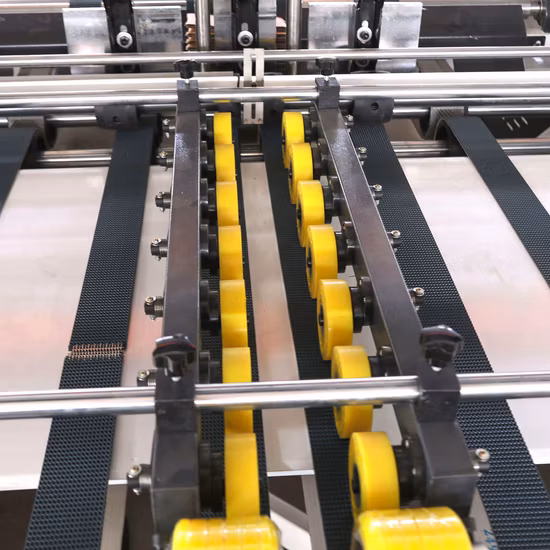 段ボール箱用自動フォルダーグルアーおよび結束機